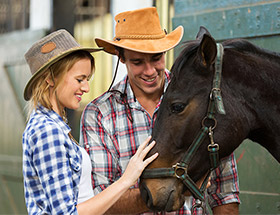 farming couple with a horse