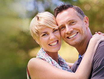 smiling couple in park