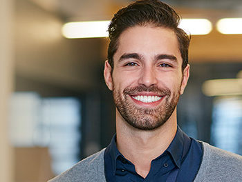 Handsome smiling man with a neat beard