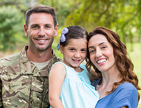 military couple with child