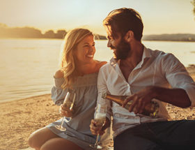 Couple enjoying a beachside sunset