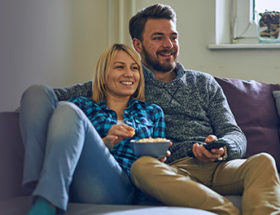 Couple watching tv together