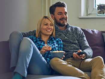 Couple watching tv together