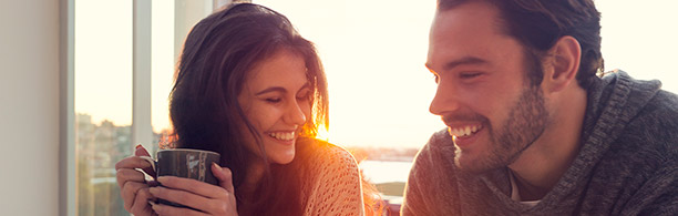 man and woman sharing coffee