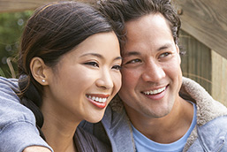 asian couple laughing together