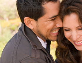 happy hispanic couple outside