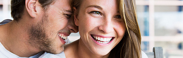 pretty woman laughing with man