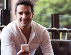 Handsome Italian man on his smartphone