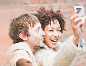 A happy couple posing for a photo