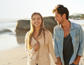 Couple walking at a romantic beach