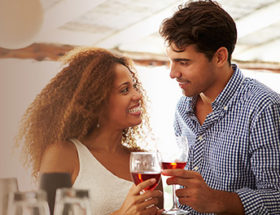 attractive couple drinking wine and smiling