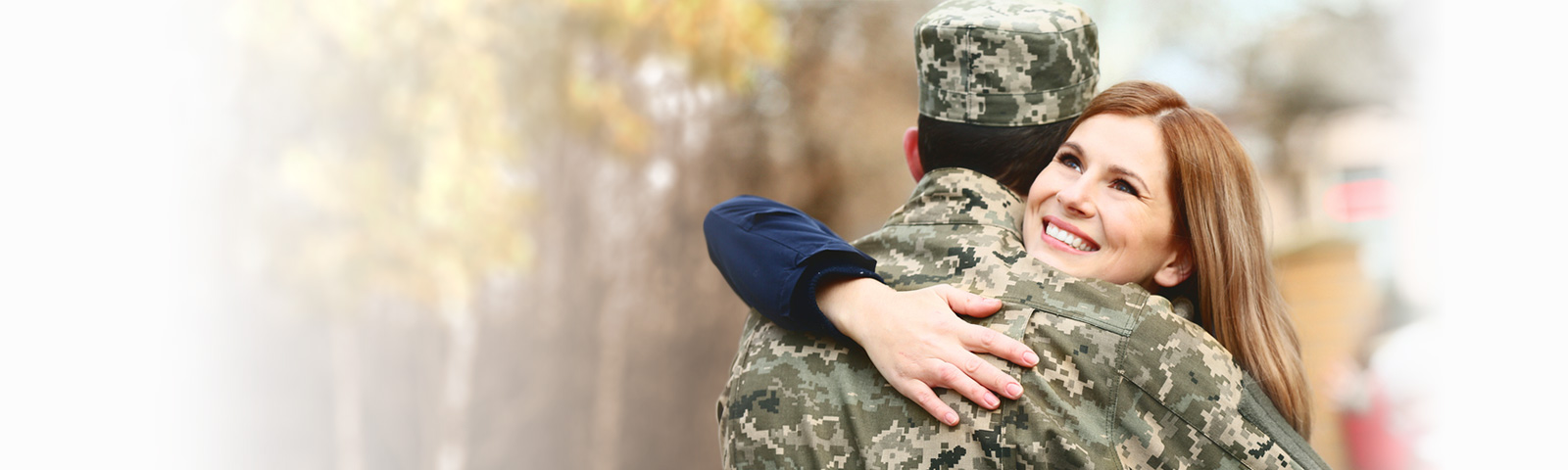 military man hugging partner