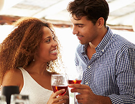 Couple having a drink together