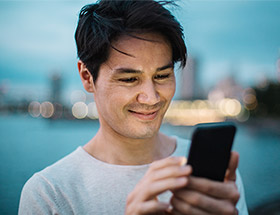 successful entrepreneur using dating app on his smartphone
