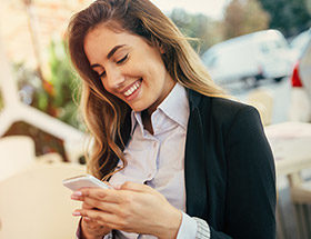 pretty woman smiling at phone