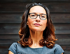 woman in glasses smiling