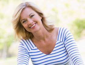 Pretty older woman in a park