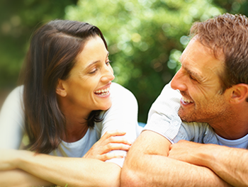 man and woman talking together outside