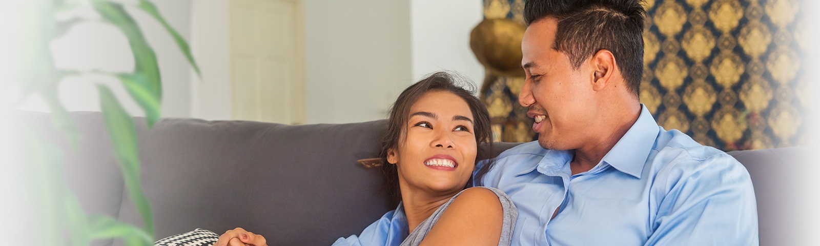 Thai couple in love on the sofa