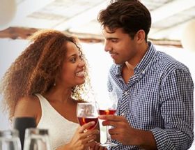 smiling couple with wine